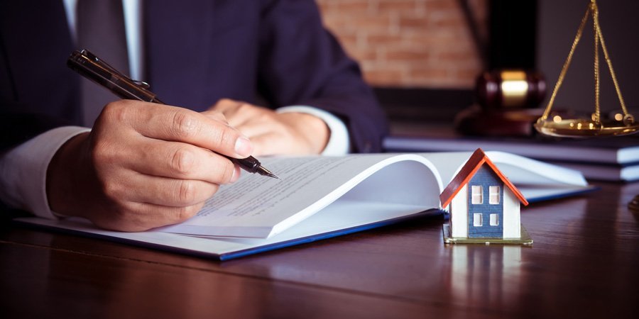 Business owners reviewing a purchase and sale agreement with an attorney